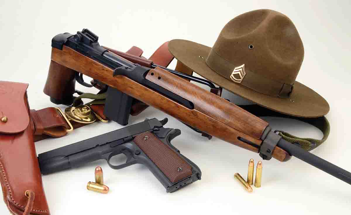 This new Inland paratrooper-style M1A1 .30 Carbine is shown with an Inland Model 1911A1 .45 ACP.